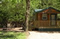 Deluxe cabin with propane grill and fire pit.